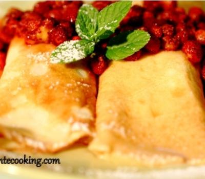 Crepes with cottage cheese filling and strawberry sauce 